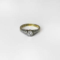 Vintage 18k gold diamond solitaire ring with a platinum setting