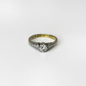 Vintage 18k gold diamond solitaire ring with a platinum setting