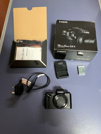 canon G5x complete in box as new. Only set up but never used . Spare camera