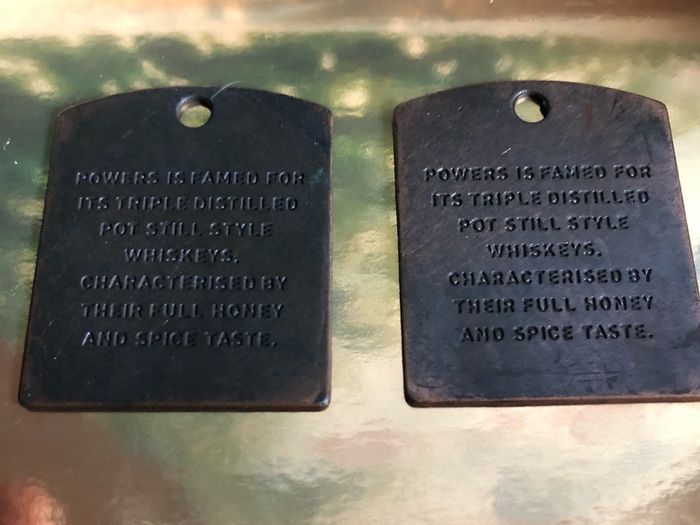 Powers whiskey medal