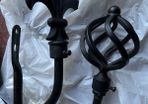 2 black curtain hold backs