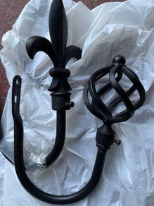 2 black curtain hold backs