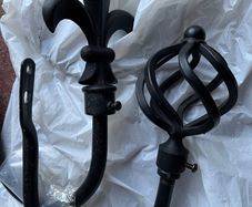 2 black curtain hold backs