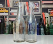 219 - Set of 2 Vintage Clear Glass Decorative Collectible Bottles
