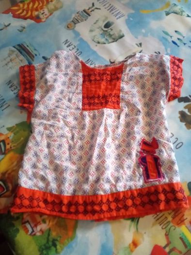 DP...am beautiful orange top with pretty details