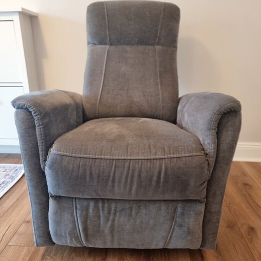 Swivel rocker reclining armchair