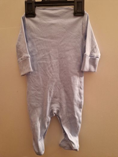 A selection of brand new baby clothes and items