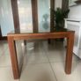 Brown wooden dining table with glass top Image 2
