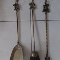 Antique French fireplace set 1950s features handles with various figures with animal finials
