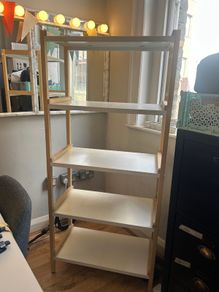 Wooden shelving unit with white shelves