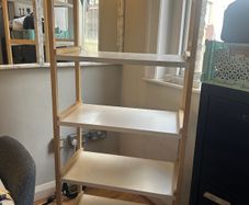 Wooden shelving unit with white shelves