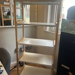 Wooden shelving unit with white shelves