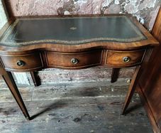 A Shereton serpentine Writing Desk