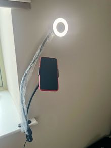 A Phone Stand with a supplementary Blue Light