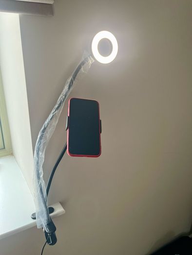 A Phone Stand with a supplementary Blue Light