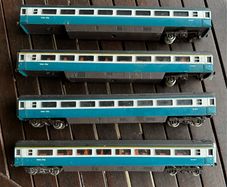 Some random parts for hornby trains. Included is 2 British rail coaches in need of repair. A Harry Potter coach. Also various goods trucks
