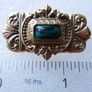 Vintage gold tone brooch with Green Faceted Stone Image 5