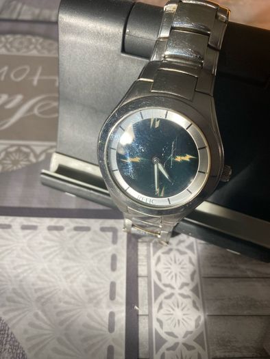 Relic face changing watch with broken watchstrap