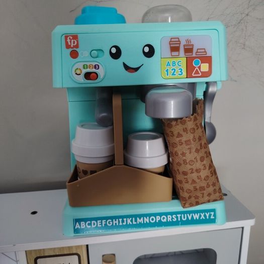 toy kitchen and coffee machine