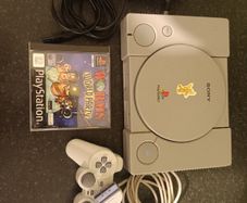 Playstation 1 with controller and game