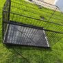 XL dog crate opens up by sliding doors at front and side. Read caption Image 7