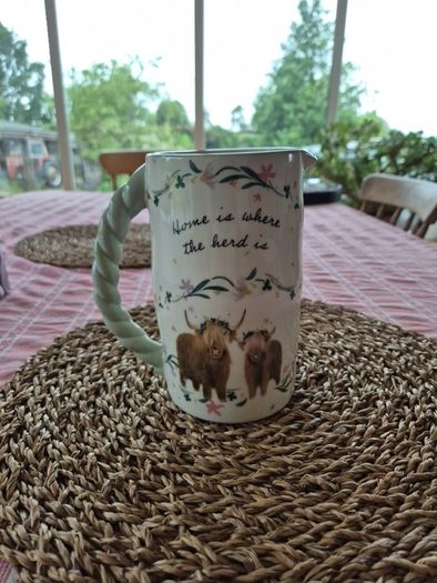 Novelty Jug : 'Home is where tge herd is'.