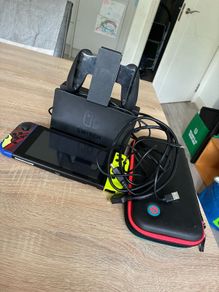 Nintendo Switch V2 Console Bundle plus dock, Joy-Cons, case and accessories.