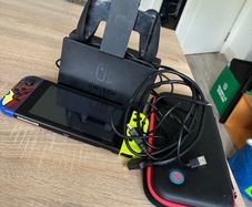 Nintendo Switch V2 Console Bundle plus dock, Joy-Cons, case and accessories.