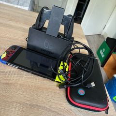 Nintendo Switch V2 Console Bundle plus dock, Joy-Cons, case and accessories.