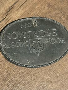 Antique begging badge