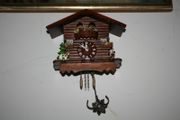 Wall Clock - the figures in the upper part of the clock are constantly moving - in working order
