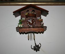 Wall Clock - the figures in the upper part of the clock are constantly moving - in working order