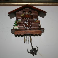 Wall Clock - the figures in the upper part of the clock are constantly moving - in working order