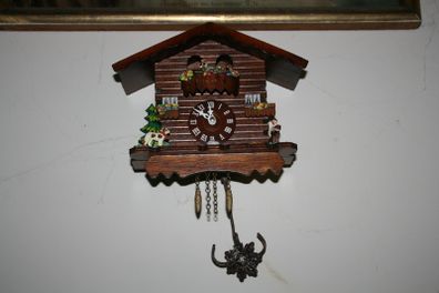 Wall Clock - the figures in the upper part of the clock are constantly moving - in working order