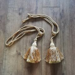 Pair of golden tassel curtain tiebacks