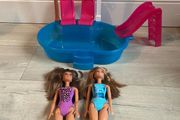 Barbie pool set plus two dolls
