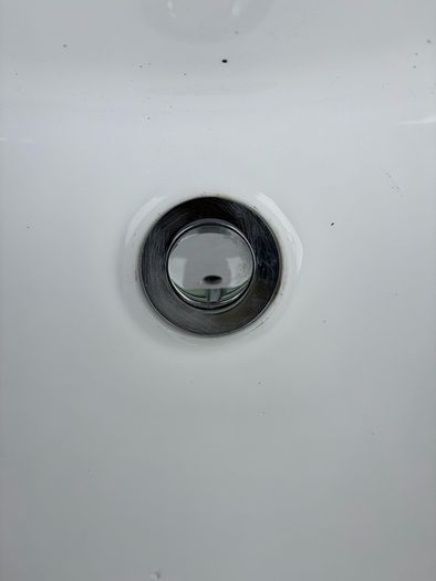 Sink with pedestal and tap