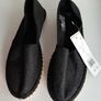 new flat black shoes with a little sparkle tag attached Image 2