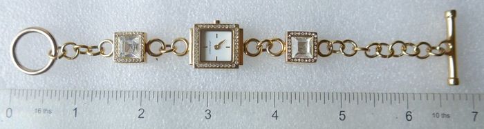 Pieces gold tone bracelet watch with crystal detail
