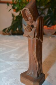 Vintage carved figurine of a reading monk