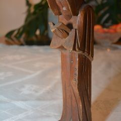 Vintage carved figurine of a reading monk