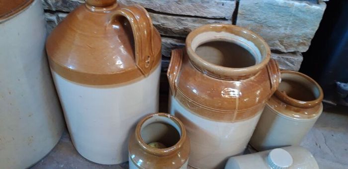 Collection of Eight Antique Stoneware Jars including Two Antique Hot Water Bottles