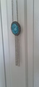 Long necklace, with turquoise centrepiece and fringe