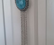 Long necklace, with turquoise centrepiece and fringe
