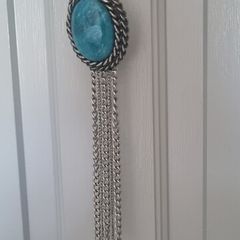 Long necklace, with turquoise centrepiece and fringe