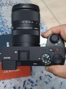 Sony a6700 along with Sigma 18-50mm lens