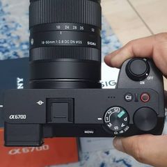 Sony a6700 along with Sigma 18-50mm lens