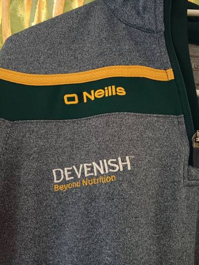 O'Neills Meath GAA Zip Top. Age 13. Width 47cm, Length 54cm. Very Good Condition. Price Includes Postage.