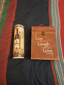 A pair of wine presentation boxes, one holds two bottles.