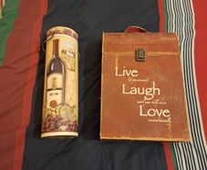 A pair of wine presentation boxes, one holds two bottles.
